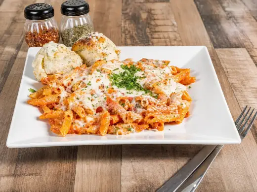 Baked Ziti with marinara, ricotta, mozzarella, parmesan, and basil