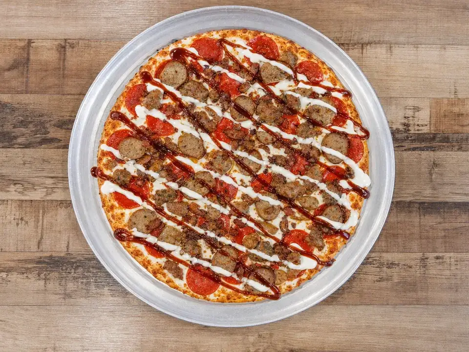 Barbecue Supreme pizza with chicken and ranch drizzle