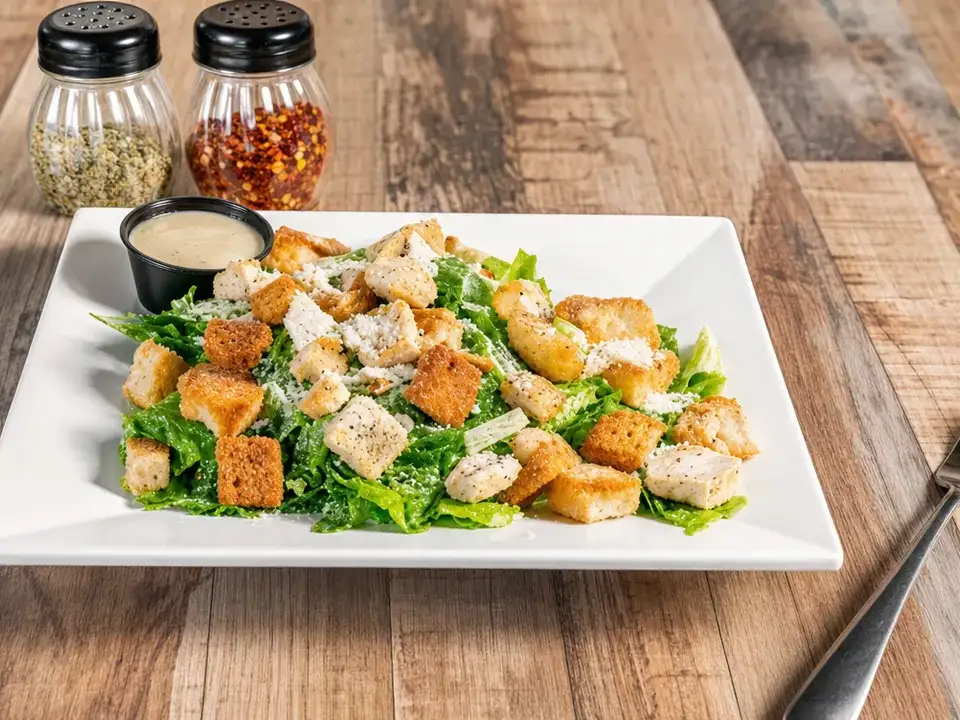 Caesar salad with croutons and parmesan cheese