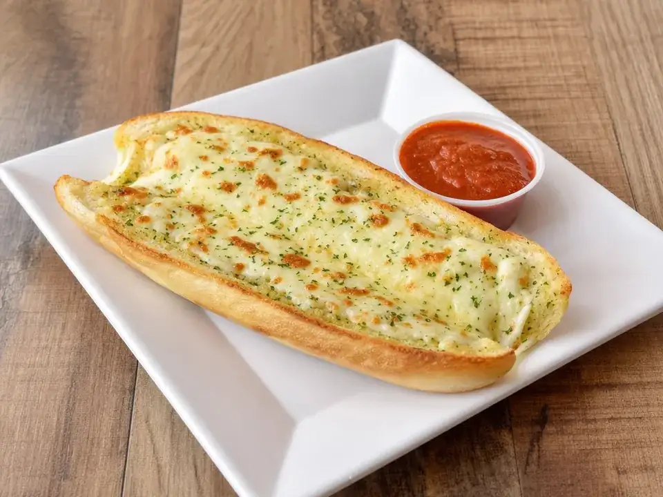 Garlic bread with melted cheese and marinara sauce