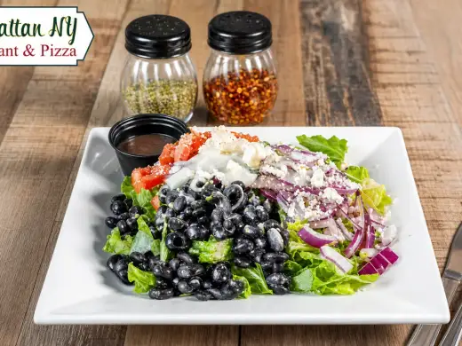House salad with tomatoes, red onions, olives, and parmesan