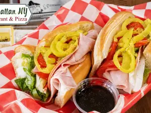 Italian sandwiches with deli meats, cheese, lettuce, and peppers