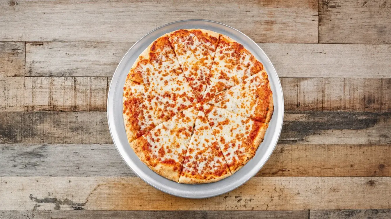 Manhattan Classic cheese pizza on a metal pizza pan