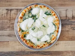 White Pie pizza with ricotta, mozzarella, and spinach
